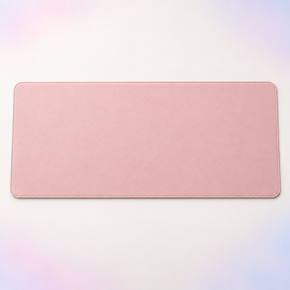 Velune Desk Pad in blush pink with stitched edges on a clean light background.