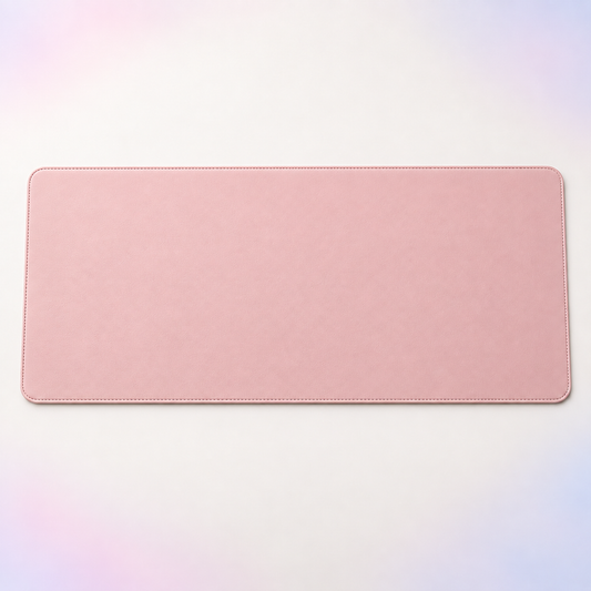 Velune Desk Pad in blush pink with stitched edges on a clean light background.