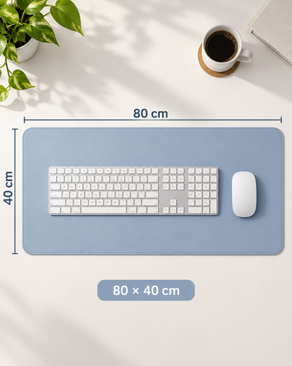 Velune Desk Pad in Soft Blue showing its 80 × 40 cm size with a full-size keyboard and mouse for realistic scale.