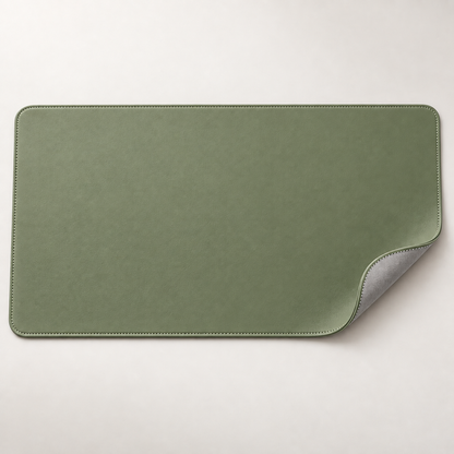 Velune Desk Pad in Sage with a lifted corner showing the grey reverse side.